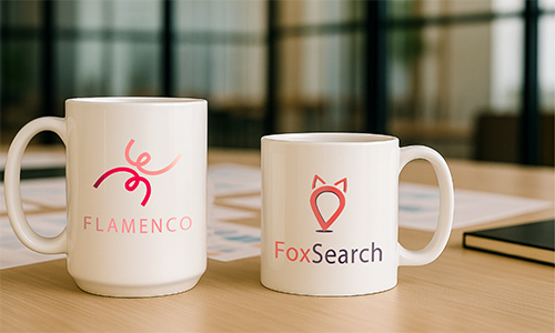 Two branded mugs: Flamenco with abstract red-pink logo, FoxSearch with red fox head design