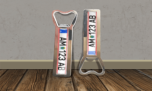 two bottle opener magnets on the floor