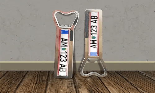 two bottle opener magnets on the floor