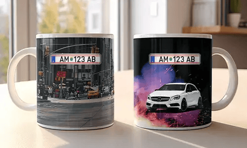 Two white mugs with car-themed prints: red BMW in urban setting, white Mercedes with sparks and colorful background
