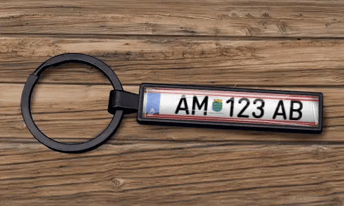 Custom license plate keychain appears with a matte black finish