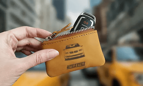 Brown zippered pouch with printed truck front and plate 