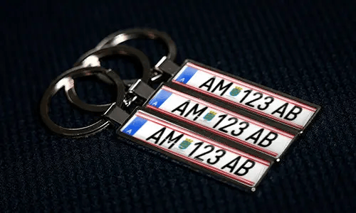 Personalized license plate keychains with custom numbers and metal finish design