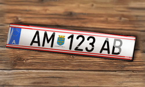 KFZ sticker-magnet on the wood background