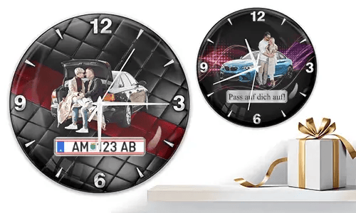 Two wall clocks with family and car scenes: left with trunk picnic on quilted background, right with blue sports car and couple over purple wave