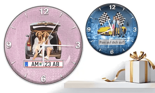 Two wall clocks with female figures and cars: left with trunk scene on pink texture, right with yellow sports car and racing flags over cityscape