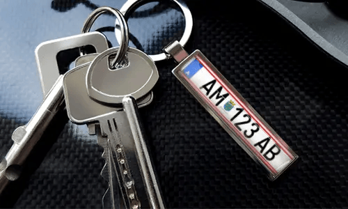 Keychain with car illustration tag and metal ring